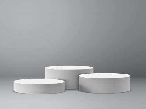 Vector collection of round white pedestals or platforms of different heights for product presentation. Realistic and minimalistic mockup or template
