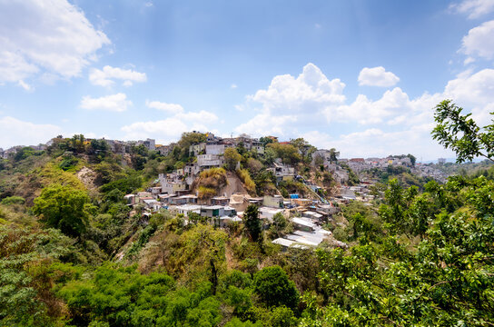 Panoramic view of houses built on the hillsides of the ravines in Guatemala City.