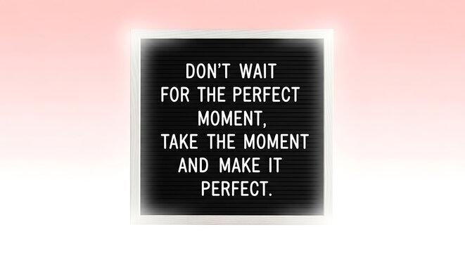 Inspirational quote on black board with pink background, motivational phrase dont wait for the perfect moment, take the moment and make it perfect