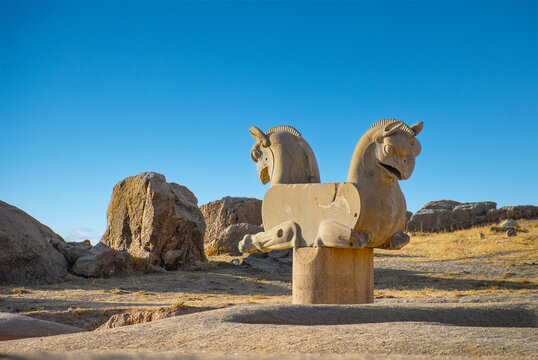 Stone column capital depicting a griffin (a mythical creature with the body of a lion and the head of an eagle), located in the ancient city of Persepolis in Iran