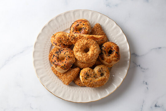 Assorted Traditional Turkish Savory Cookies and Kandil Simidi on a White Plate