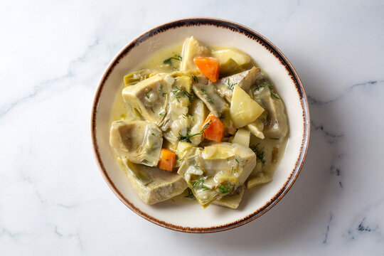 Traditional Turkish Braised Artichoke (Enginar) with Potatoes and Carrots in Olive Oil