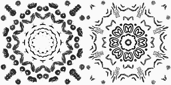 Abstract symmetrical patterns resembling floral or kaleidoscopic designs