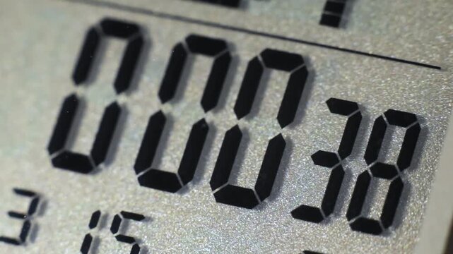Digital timer and stopwatch running on a digital watch lcd display