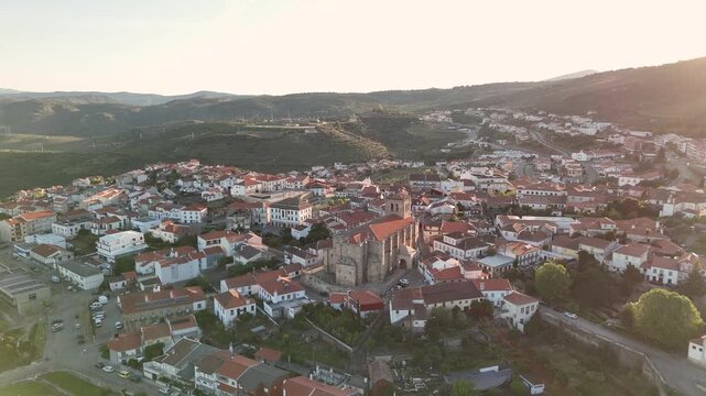 Aerial drone flying over freixo de espada a cinta at sunset