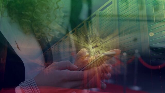 Woman tapping phone, causing animated radial flare sweeping across lockers while monitoring servers
