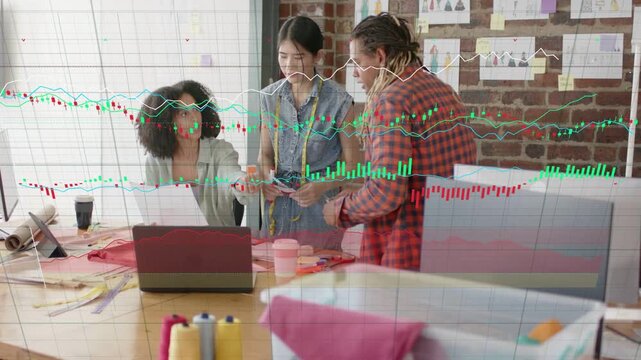 Seated designer pointing at paper causing graphs rising as team swapping swatches finalizing design