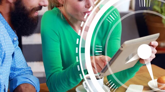 Woman tapping tablet man leaning at cafe viewing tech demo while clock graphic sweeping foreground