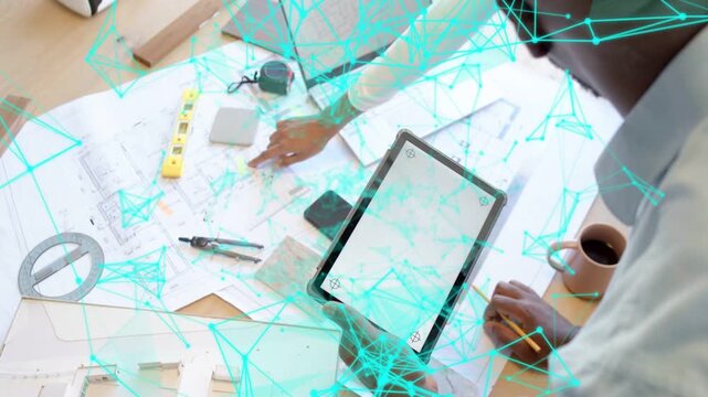 Vertical video: Female reaching plans man moving tablet aligning design with drifting blue overlay