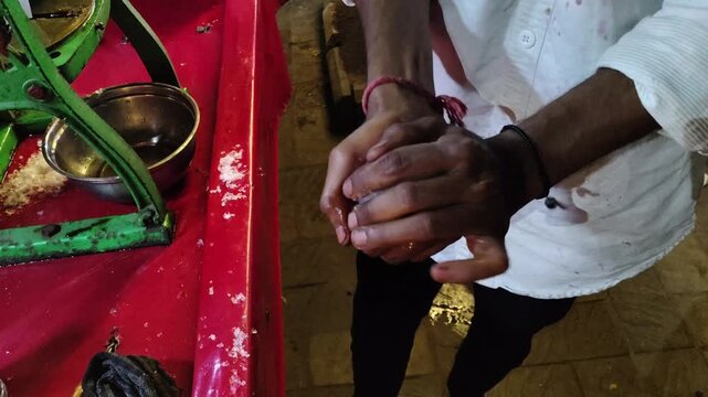 Making of a Gola: Street Vendor Shaping a Traditional Indian Ice Gola Ball