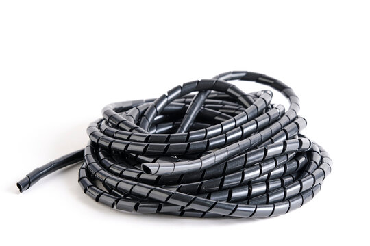 Side perspective bundle of black spiral cable conduit, showing the texture and flexibility.