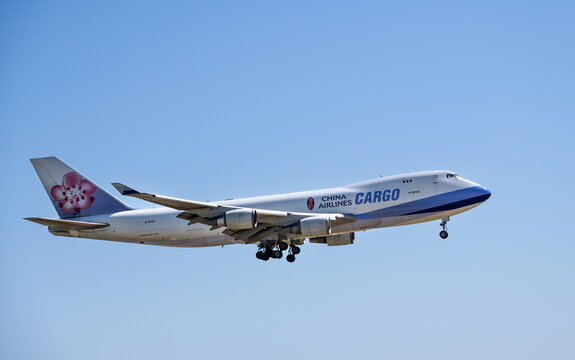 China Airlines Cargo aircraft Boeing 747-400 airborne over the Dallas Fort Worth International Airport (DFW). Plum blossom livery. 