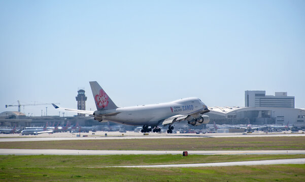 China Airlines Cargo aircraft Boeing 747-400 landing at the Dallas Fort Worth International Airport (DFW). Plum blossom livery.