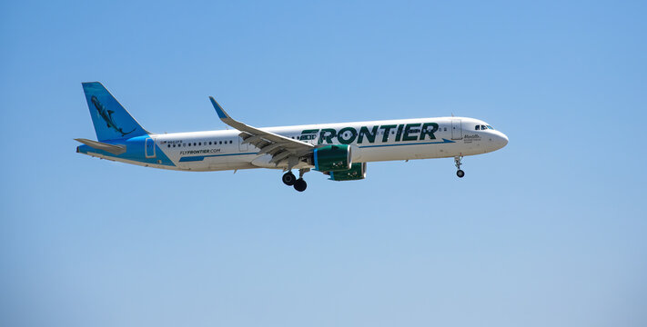 Frontier Airlines aircraft Airbus A321neo airborne over Dallas Fort Worth International Airport (DFW). Martillo the Bonnethead Shark livery.