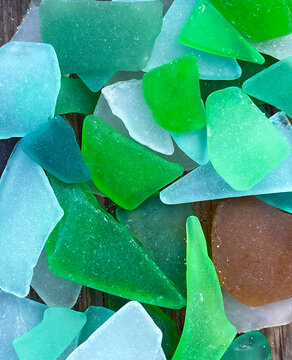 Colorful sea glass pieces close-up, abstract coastal background