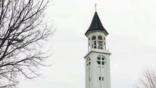 Christian Cross and Bell Tower of San Jose Parish in San Martin de los Andes - 4K