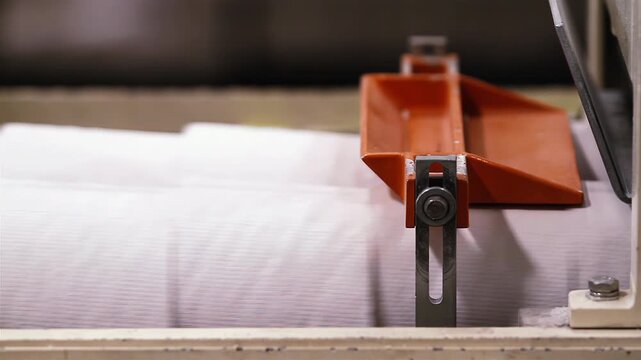 Industrial Machinery Processing Toilet Paper Rolls in Manufacturing Plant - 4K