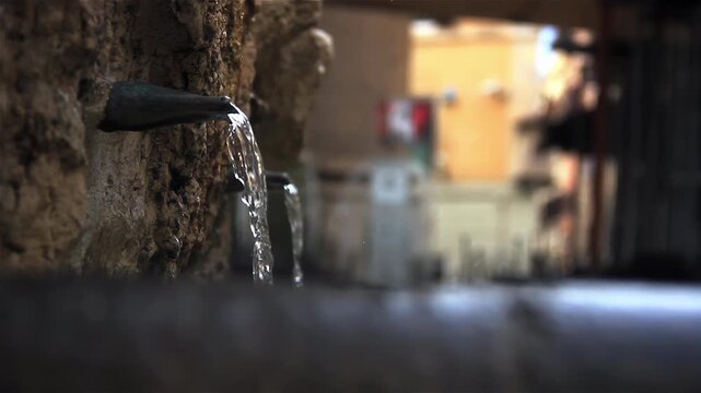 Water Stream Pouring from Ancient Stone Pipe at Babuino Fountain Italy - 4K