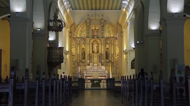 Interior of Asuncion Metropolitan Cathedral with Golden Altar and Vatican Flag - 4K