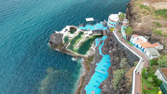 Dramatic aerial drone view of Doca do Cavacas natural volcanic pools and rugged Madeira cliffs