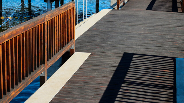 Wooden fence on jetty pier over lake in Pobiedziska Poland