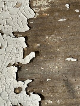 Vintage weathered wood background with cracked peeling paint and rustic texture