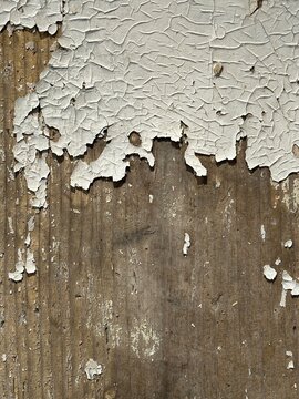 Vintage weathered wood background with cracked peeling paint and rustic texture