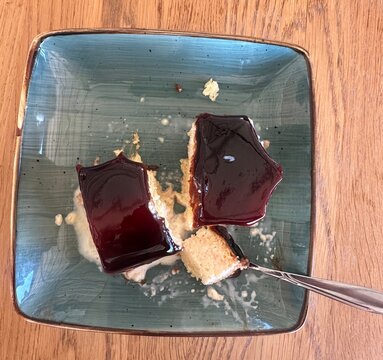 Top view of delicious cake slices served on a ceramic plate