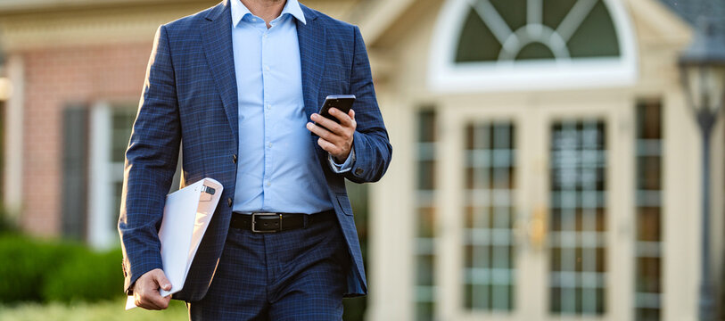 Property insurance promotion. Successful broker. American businessman with phone. Real estate agent at house for sale. Realtor chatting on phone. Rent or buy new home. Home insure, copy space