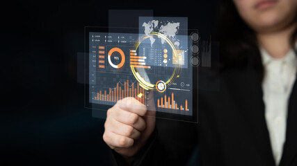 Obraz premium A business professional engages with an advanced digital interface that showcases data analytics, featuring charts, graphs, and a world map for corporate insights. Scalp