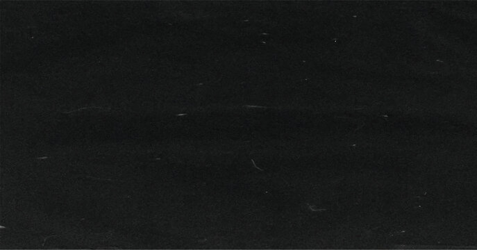 Dark grunge film grain texture with subtle noise and dust effect