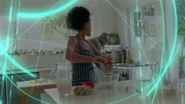 Woman measuring with red cup, stirring in bowl, drawing partner in as teal overlays frame cooking