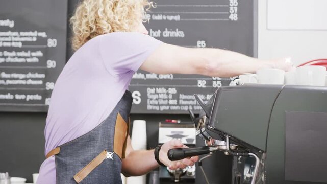 Male barista aligning portafilter placing cup pulling espresso for order overlays showing motion