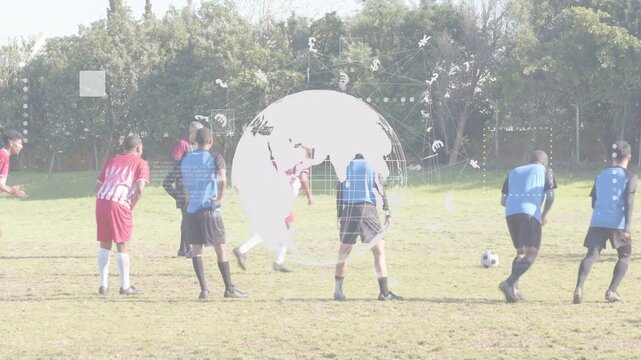 Soccer red kicker running up and kicking ball globe overlay masking pitch red team celebrating goal
