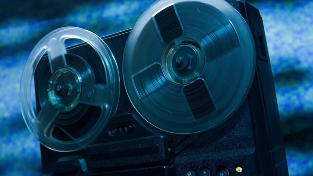 Tape audio music player, VHS studio magnetic tape, vintage retro spool reel to reel player and recorder, magnetic tape data storage close up, music studio. 