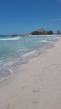 Ita&uacute;na Beach, with beautiful waves suitable for surfing in Brazil. One of the best beaches in the state of Rio de Janeiro. Blue skies, white sands, and crystal-clear waters, blue waves.