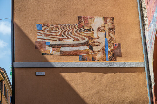 Italy, 10/04/26: Colorful street art murals decorate the medieval village of Dozza, with the historic Rocca fortress overlooking charming alleys, blending history, culture, and artistic expression.