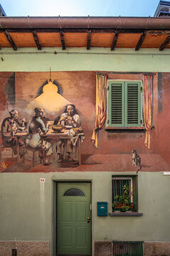 Italy, 10/04/26: Colorful street art murals decorate the medieval village of Dozza, with the historic Rocca fortress overlooking charming alleys, blending history, culture, and artistic expression.