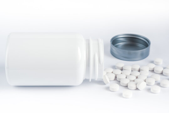 Flacon de m&eacute;dicaments. Avec cachets &eacute;parpill&eacute;s. 