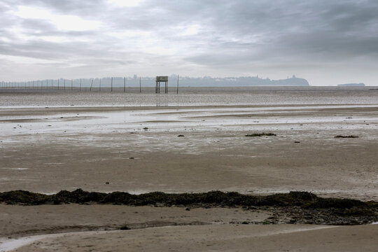 The Pilgrims' Way across the Holy Island Sands to Lindisfarne, Northumberland, UK, with a pedestrian refuge part way across for anyone caught out by a rising tide