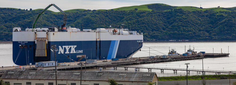 NYK Line roll‑on roll‑off cargo vessel docked at the Martinez waterfront terminal