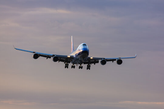 Passenger airplane arriving at Anchorage airport during sunset. Anchorage, Alaska, May 2022