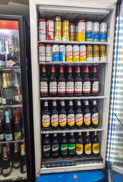 Iguazu, Brazil, March 08, 2026, Brahma, Budweiser, cans, glass bottles, assortment of beer brands on shelves inside a commercial refrigerator.