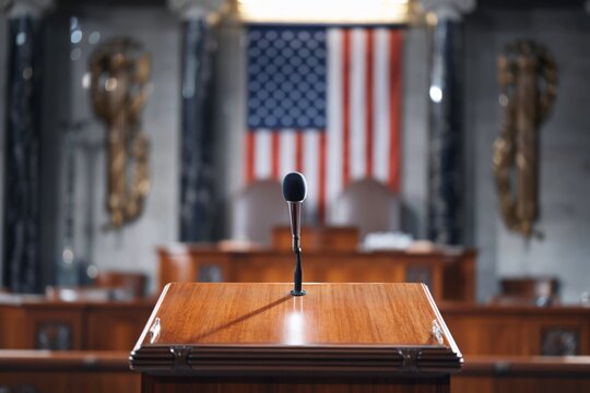 Speakers Podium in Front of American Flag in a Congressional Chamber During a Session