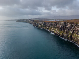 Obraz premium Beautiful arial view of Kilt Rock and Mealt Falls, Isle of Skye Scotland – Dramatic Coastal Cliffs and Waterfall Landscape
