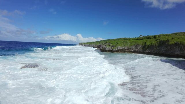 FPV Drone Flying Over Volcanic Coast and Waves in Niue