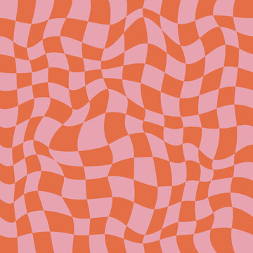 Groovy seamless background with a retro checkerboard design in pink and orange. Abstract pattern.