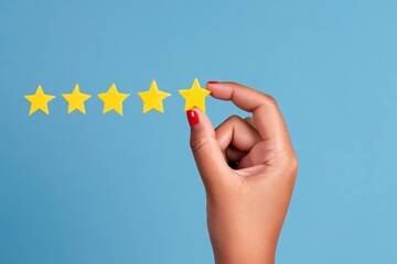 Fototapeta premium Hand Holds Five Yellow Stars Against a Blue Background in a Review or Rating Context