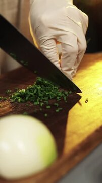 Fresh green onion chopping in modern kitchen