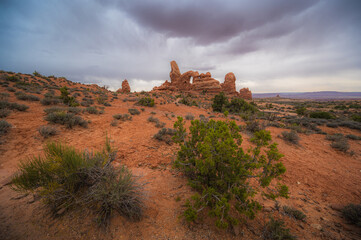 Dramatic and colorful landscape of Arches National Park Utah USA, turret arch on a moody cloudy day. nature and travel banner. copy space, tourism © piksik